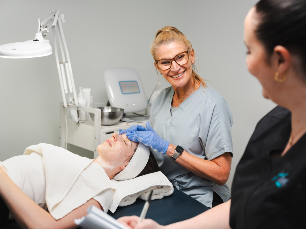 Student in the Aspire Training Clinic learning advanced dermal treatments