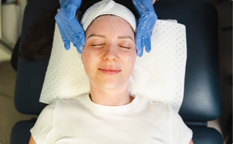 Woman receiving facial treatment